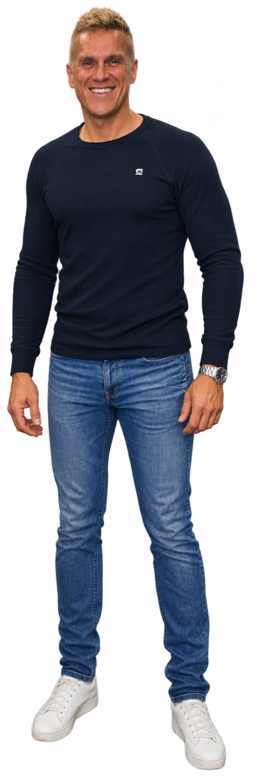 Kees Been, full length, smiling, navy G-Star sweater, blue jeans and white sneakers